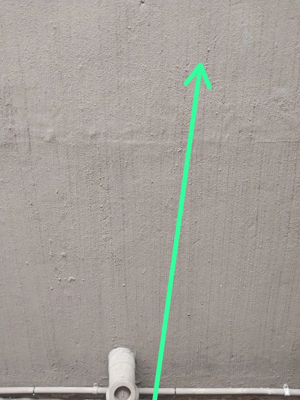 Leak detection evidence on a wall with an arrow showing the suspected water path for a Blairgowrie home.