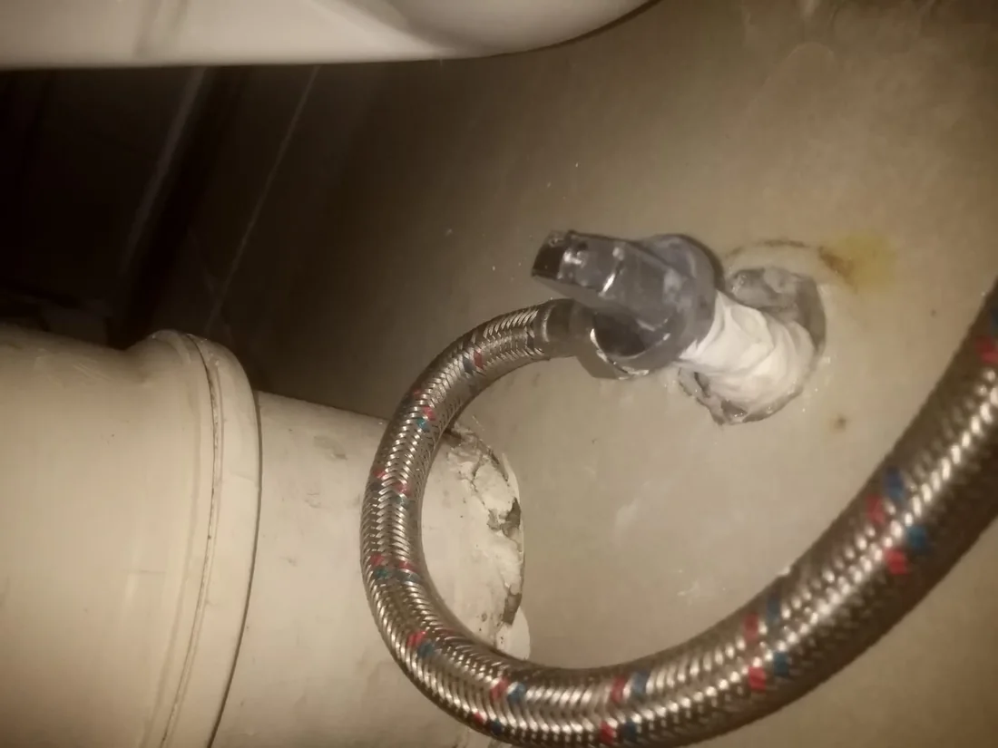 Toilet flexi pipe replaced behind a toilet after signs of leakage in a Blairgowrie bathroom.