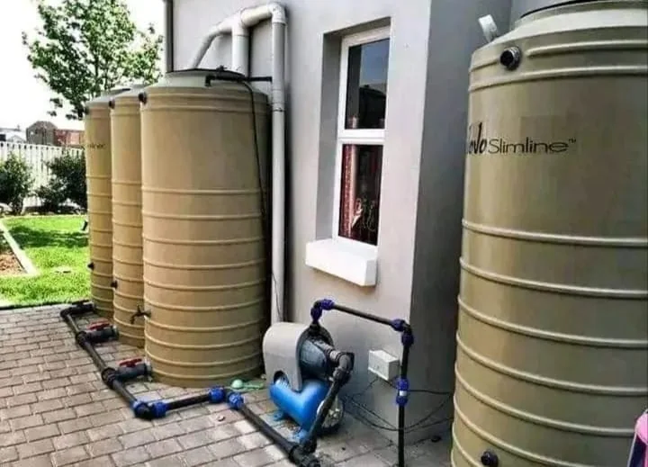 JoJo tank installation with multiple storage tanks and pump connection for a Bordeaux client.