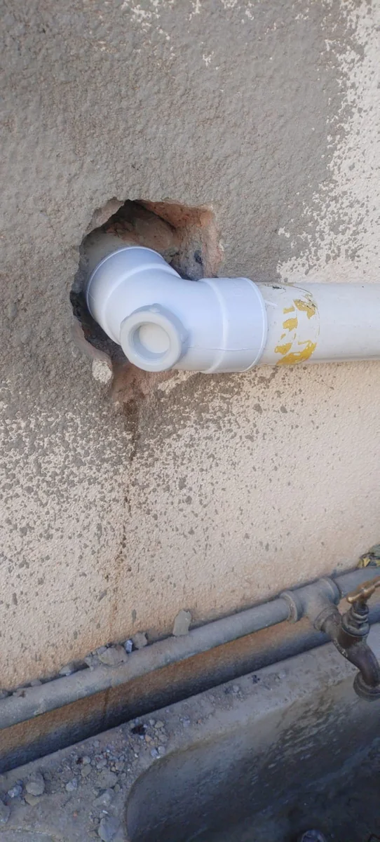 Leaking waste pipe repaired through a wall for a Bordeaux plumbing client by Plumb A Nator.