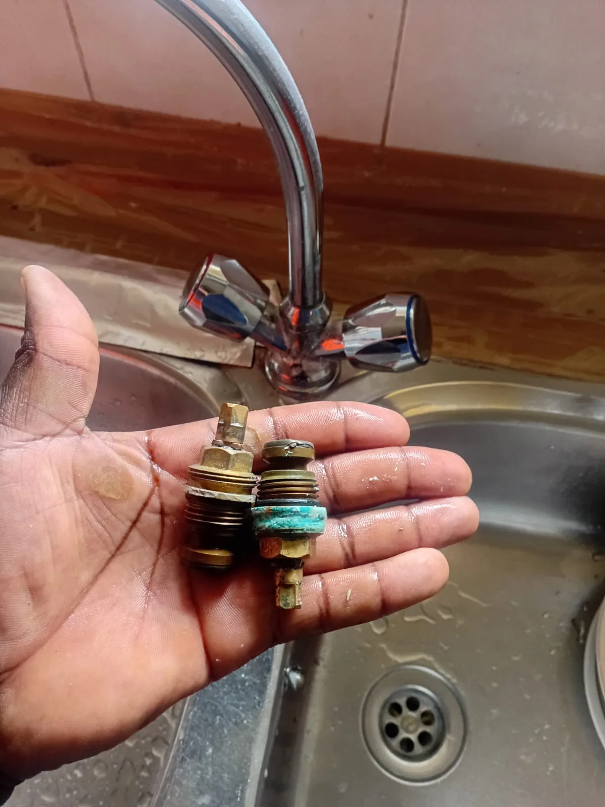 Worn Cresta kitchen tap cartridges removed during mixer repair and pressure-related fault diagnosis by Plumb A Nator.