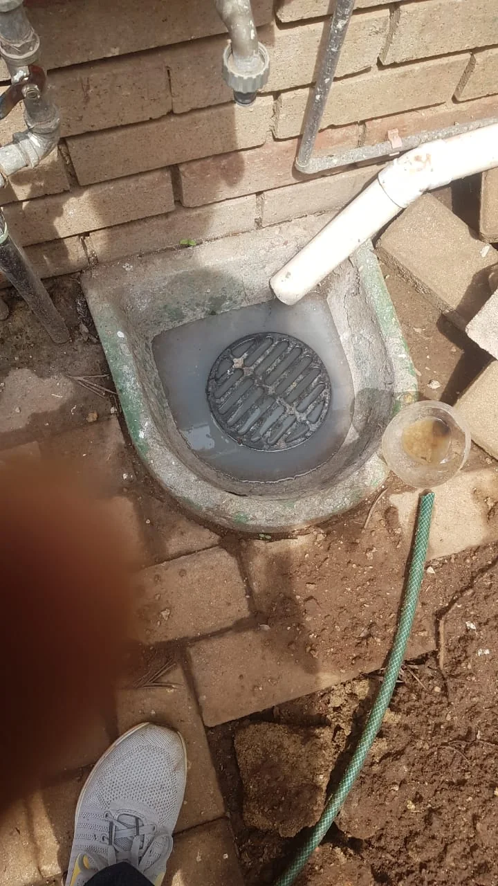 Blocked outdoor drain and gully being opened during a Bromhof plumbing callout.