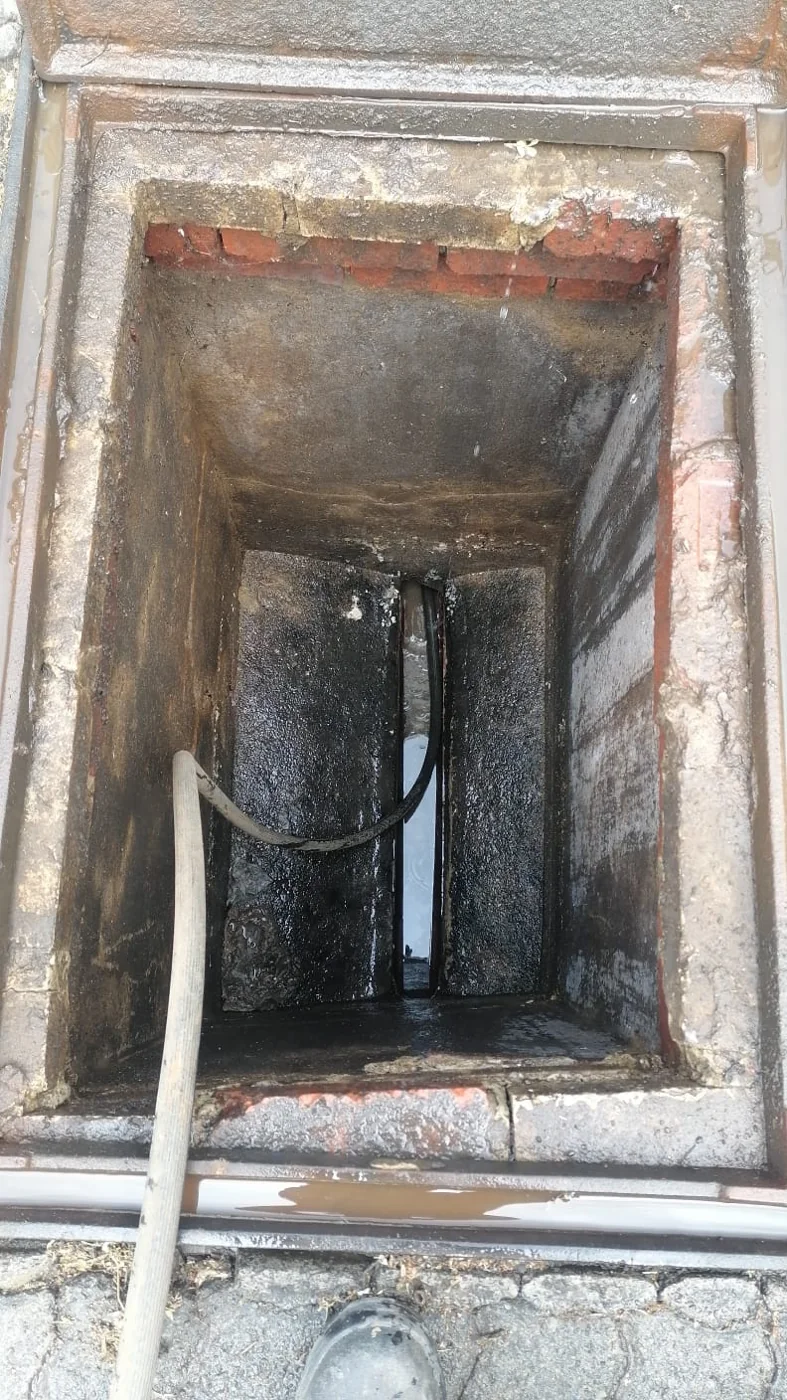 Sewer chamber being cleaned during a Bromhof sewer main line service by Plumb A Nator.
